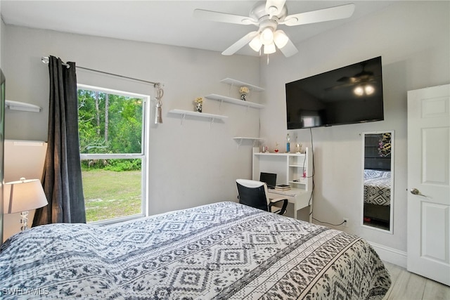 2711 4th St NW, Naples, FL 34120 - bedroom with wood finished floors and ceiling fan