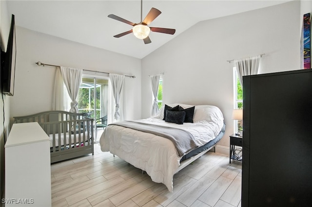 2711 4th St NW, Naples, FL 34120 - bedroom with vaulted ceiling, access to exterior, light wood-style flooring, and ceiling fan