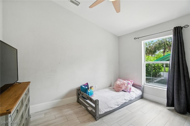 2711 4th St NW, Naples, FL 34120 - bedroom featuring ceiling fan and light wood-style flooring