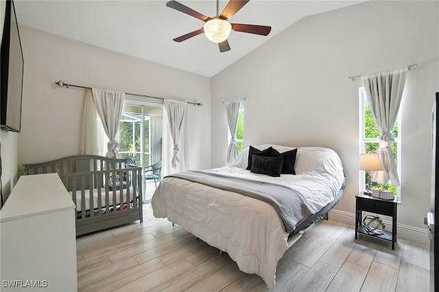 2711 4th St NW, Naples, FL 34120 - bedroom featuring access to outside, lofted ceiling, light wood-style flooring, and a ceiling fan