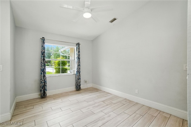2711 4th St NW, Naples, FL 34120 - spare room with wood finished floors, a ceiling fan, and vaulted ceiling