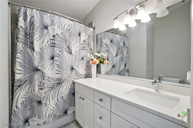 2711 4th St NW, Naples, FL 34120 - bathroom with vanity and a shower with curtain