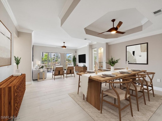 26690 Egrets Landing Dr Unit 101, Bonita Springs, FL 34134 - dining room with ceiling fan, ornamental molding, and a tray ceiling