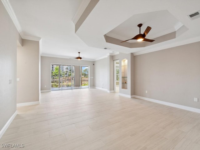 26690 Egrets Landing Dr Unit 101, Bonita Springs, FL 34134 - unfurnished room featuring a ceiling fan, ornamental molding, a raised ceiling, and light wood-type flooring