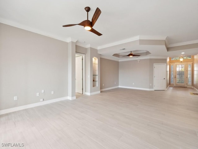 26690 Egrets Landing Dr Unit 101, Bonita Springs, FL 34134 - spare room with ceiling fan, a tray ceiling, crown molding, and light wood-type flooring