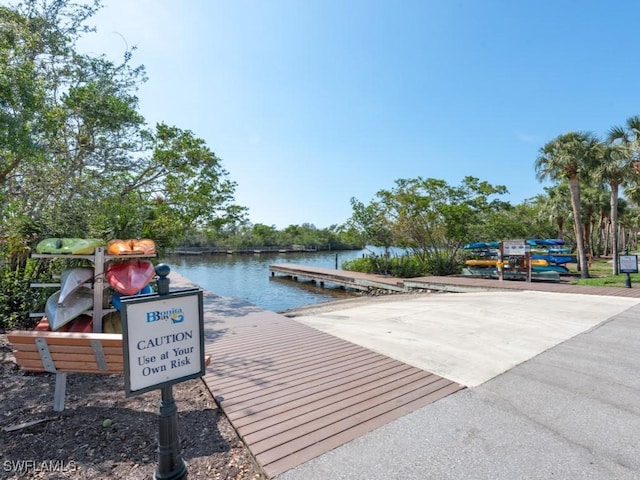 26690 Egrets Landing Dr Unit 101, Bonita Springs, FL 34134 - dock area with a water view and a boat ramp