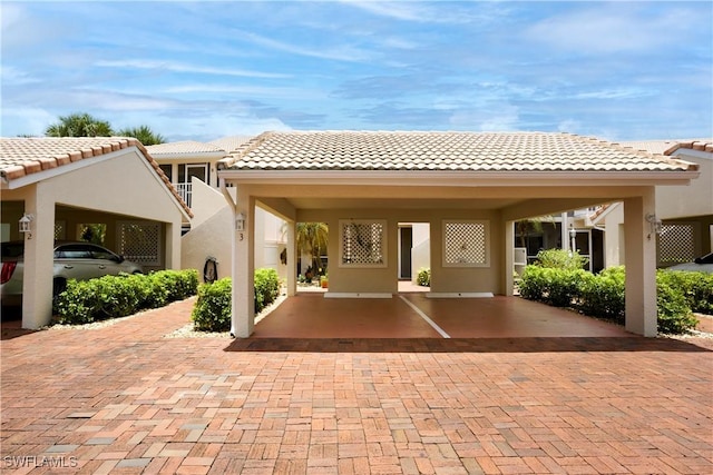 2396 Hidden Lake Dr Unit 3, Naples, FL 34112 - back of property featuring stucco siding and a tile roof