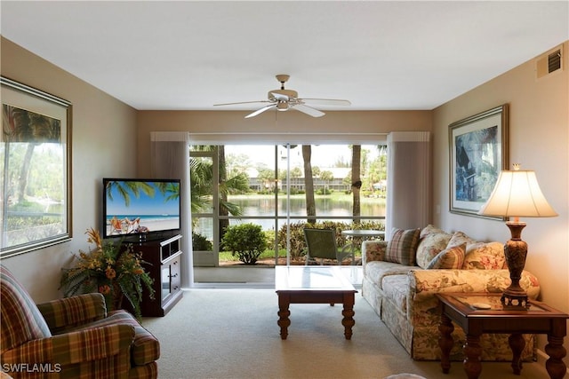 2396 Hidden Lake Dr Unit 3, Naples, FL 34112 - carpeted living area with healthy amount of natural light and ceiling fan