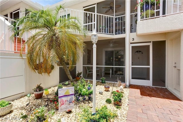 2396 Hidden Lake Dr Unit 3, Naples, FL 34112 - entrance to property with ceiling fan and stucco siding