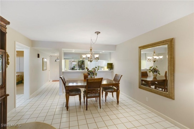 2396 Hidden Lake Dr Unit 3, Naples, FL 34112 - dining area with a chandelier and light tile patterned floors