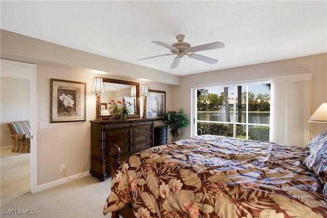 2396 Hidden Lake Dr Unit 3, Naples, FL 34112 - carpeted bedroom with a ceiling fan and a water view