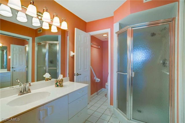 2396 Hidden Lake Dr Unit 3, Naples, FL 34112 - bathroom with tile patterned floors, a stall shower, and vanity