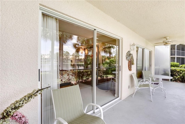 2396 Hidden Lake Dr Unit 3, Naples, FL 34112 - sunroom featuring ceiling fan, a textured ceiling, healthy amount of natural light, and a textured wall