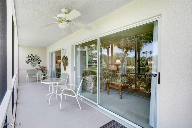 2396 Hidden Lake Dr Unit 3, Naples, FL 34112 - sunroom featuring a ceiling fan, a textured ceiling, carpet flooring, and a textured wall