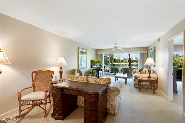 2396 Hidden Lake Dr Unit 3, Naples, FL 34112 - living area featuring plenty of natural light, a ceiling fan, and light colored carpet