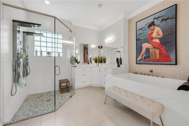 3910 Glacier Ct, Naples, FL 34119 - bathroom with vanity, crown molding, a shower stall, a garden tub, and tile patterned flooring