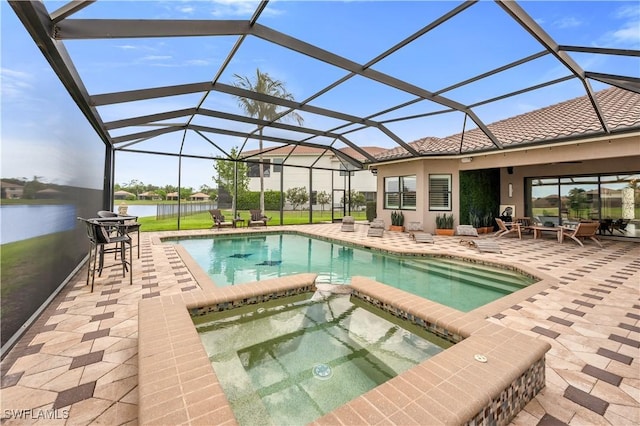 3910 Glacier Ct, Naples, FL 34119 - view of swimming pool featuring a patio, a pool with connected hot tub, a water view, and a lanai