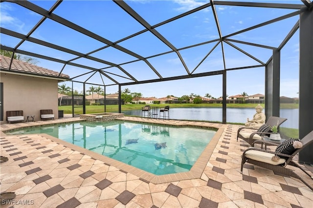 3910 Glacier Ct, Naples, FL 34119 - view of pool featuring a patio area, a pool with connected hot tub, glass enclosure, and a water view