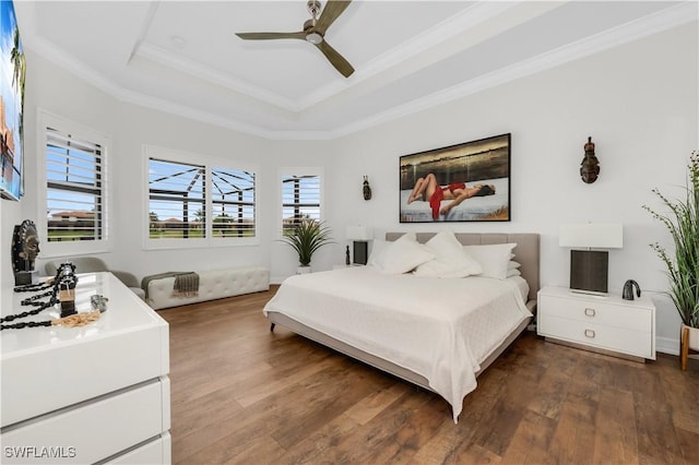 3910 Glacier Ct, Naples, FL 34119 - bedroom with a raised ceiling, wood finished floors, ornamental molding, and ceiling fan