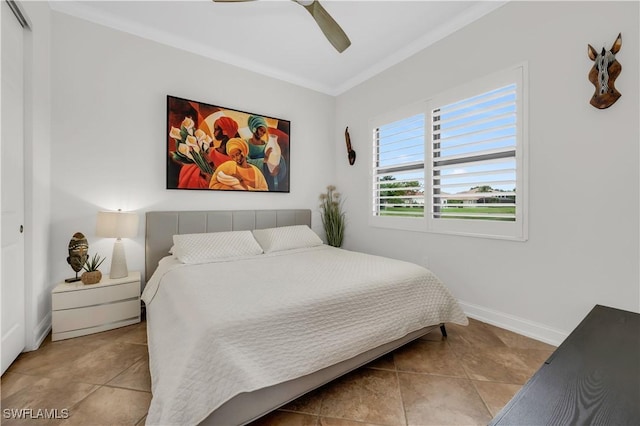 3910 Glacier Ct, Naples, FL 34119 - tiled bedroom featuring crown molding, a ceiling fan, and a closet