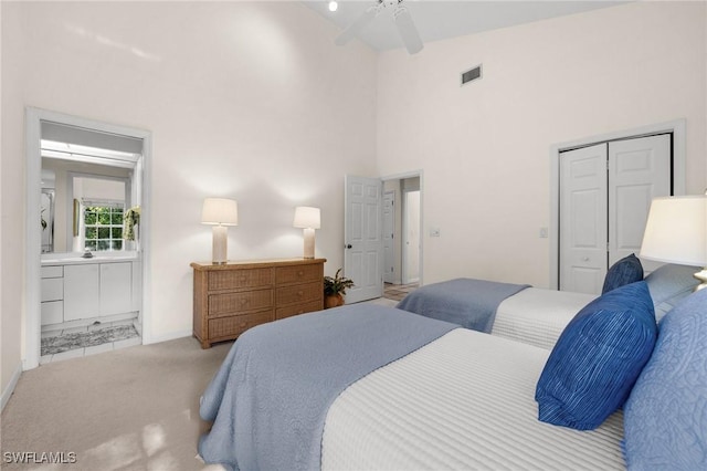 24881 Pennyroyal Dr, Bonita Springs, FL 34134 - bedroom with a high ceiling, a closet, ensuite bath, ceiling fan, and carpet floors