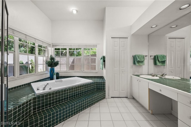 24881 Pennyroyal Dr, Bonita Springs, FL 34134 - full bath with a closet, a garden tub, vanity, tile patterned floors, and recessed lighting