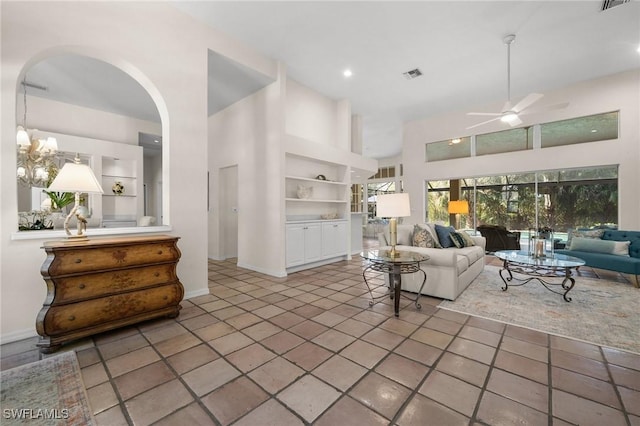 24881 Pennyroyal Dr, Bonita Springs, FL 34134 - living room with ceiling fan, high vaulted ceiling, arched walkways, and tile patterned floors