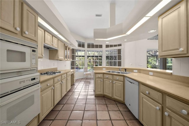 24881 Pennyroyal Dr, Bonita Springs, FL 34134 - kitchen with white appliances, backsplash, light countertops, plenty of natural light, and recessed lighting
