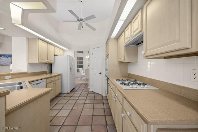 24881 Pennyroyal Dr, Bonita Springs, FL 34134 - kitchen featuring white appliances, under cabinet range hood, a ceiling fan, decorative backsplash, and light countertops