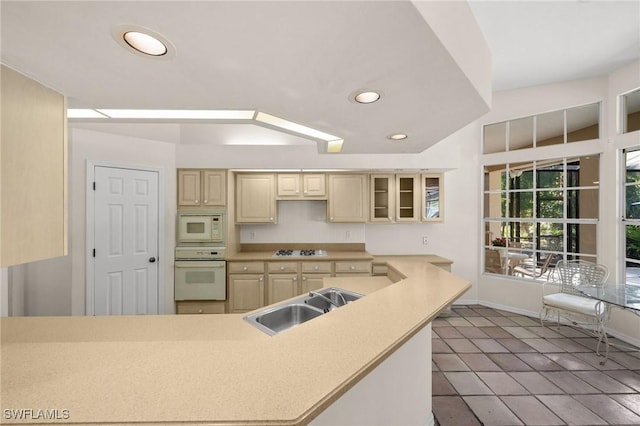 24881 Pennyroyal Dr, Bonita Springs, FL 34134 - kitchen featuring white appliances, recessed lighting, glass insert cabinets, tile patterned flooring, and light countertops