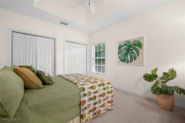 24881 Pennyroyal Dr, Bonita Springs, FL 34134 - bedroom with multiple closets, carpet flooring, and a ceiling fan