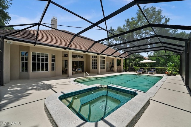 24881 Pennyroyal Dr, Bonita Springs, FL 34134 - view of pool with a patio area, a pool with connected hot tub, and glass enclosure