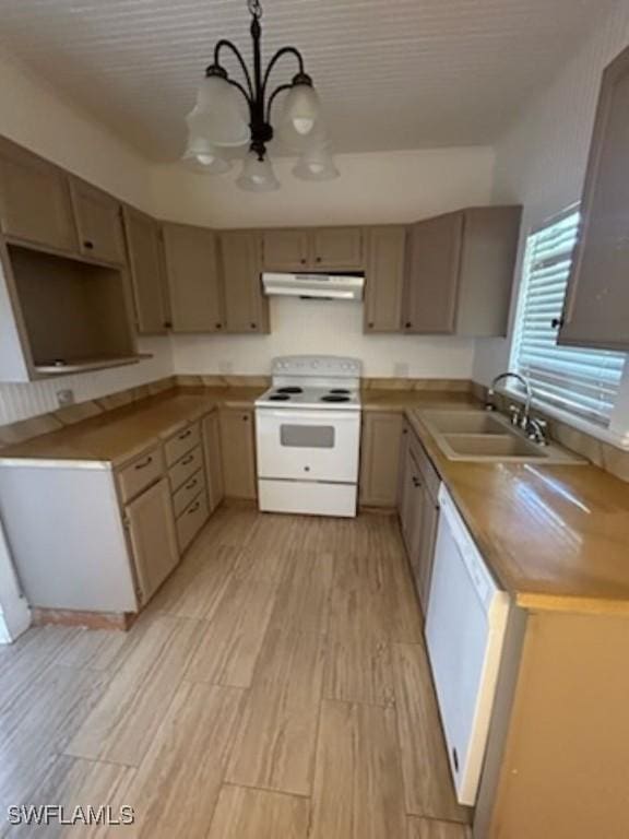 539 E Pasadena Ave, Clewiston, FL 33440 - kitchen with white appliances, under cabinet range hood, a chandelier, light wood finished floors, and pendant lighting