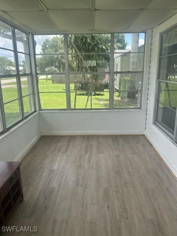 539 E Pasadena Ave, Clewiston, FL 33440 - unfurnished sunroom with a drop ceiling and wood finished floors