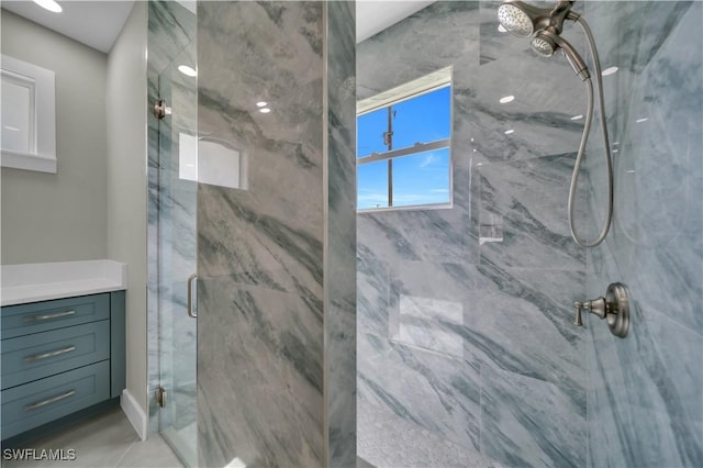 4205 Nora Ave S, Lehigh Acres, FL 33976 - full bathroom featuring a marble finish shower and vanity