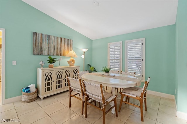 2548 River Reach Dr, Naples, FL 34104 - dining space featuring lofted ceiling and light tile patterned flooring