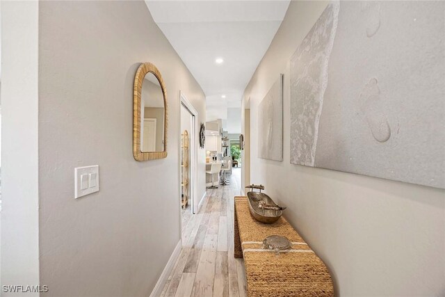 2450 Old Groves Rd Unit 201, Naples, FL 34109 - hall featuring light wood finished floors and recessed lighting