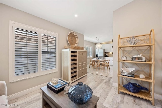 2450 Old Groves Rd Unit 201, Naples, FL 34109 - living area featuring light wood-type flooring and recessed lighting