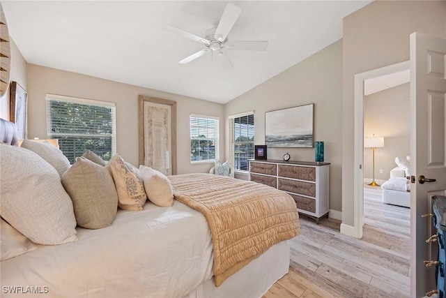 2450 Old Groves Rd Unit 201, Naples, FL 34109 - bedroom featuring light wood-style floors, lofted ceiling, and a ceiling fan