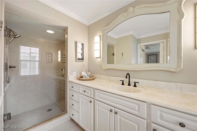 2450 Old Groves Rd Unit 201, Naples, FL 34109 - full bathroom featuring a shower stall, vanity, ceiling fan, and crown molding