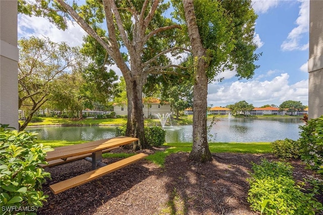 2450 Old Groves Rd Unit 201, Naples, FL 34109 - view of yard featuring a water view