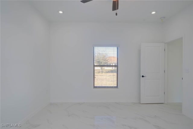 2107 Jefferson Ave, Alva, FL 33920 - spare room with marble look tiles, a ceiling fan, and recessed lighting