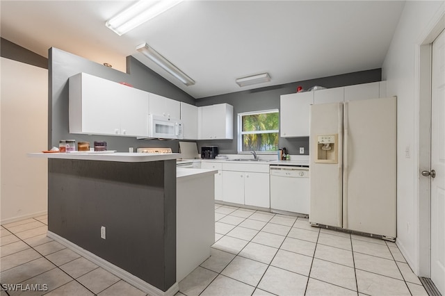 5421/5423 Centennial Blvd, Lehigh Acres, FL 33971 - kitchen with white appliances, vaulted ceiling, white cabinets, light countertops, and light tile patterned floors