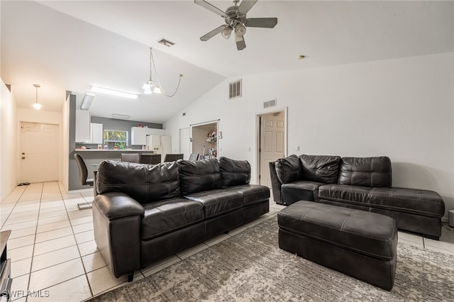 5421/5423 Centennial Blvd, Lehigh Acres, FL 33971 - living area with vaulted ceiling, ceiling fan, and light tile patterned flooring