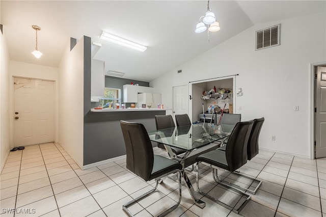 5421/5423 Centennial Blvd, Lehigh Acres, FL 33971 - dining space featuring lofted ceiling and light tile patterned floors