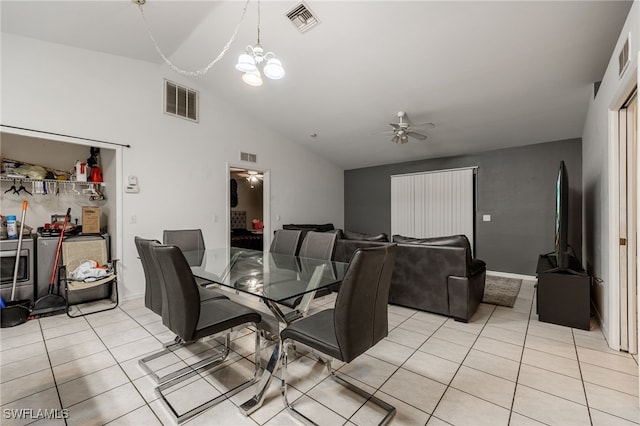 5421/5423 Centennial Blvd, Lehigh Acres, FL 33971 - dining room with ceiling fan, light tile patterned floors, lofted ceiling, and a chandelier