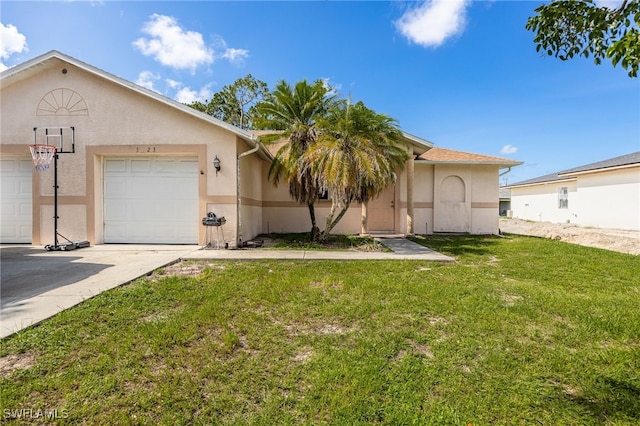 5421/5423 Centennial Blvd, Lehigh Acres, FL 33971 - view of front of house with stucco siding, a front lawn, driveway, and a garage