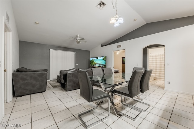 5421/5423 Centennial Blvd, Lehigh Acres, FL 33971 - dining room featuring lofted ceiling, ceiling fan, light tile patterned flooring, arched walkways, and a chandelier