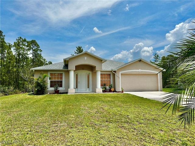 2675 70th Ave NE, Naples, FL 34120 - view of front facade with stucco siding, an attached garage, concrete driveway, and a front yard