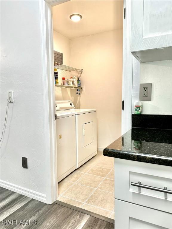 2675 70th Ave NE, Naples, FL 34120 - washroom with washer and dryer and light wood-type flooring